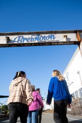 Group of people walking under Brewtown sign in Upper Hutt.