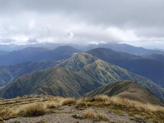 A mountain range under a cloudy sky.