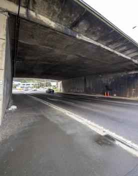 The urban setting of the Hutt Road Ngauranga Interchange, where highways got over tunnels with walls that once had graffiti.