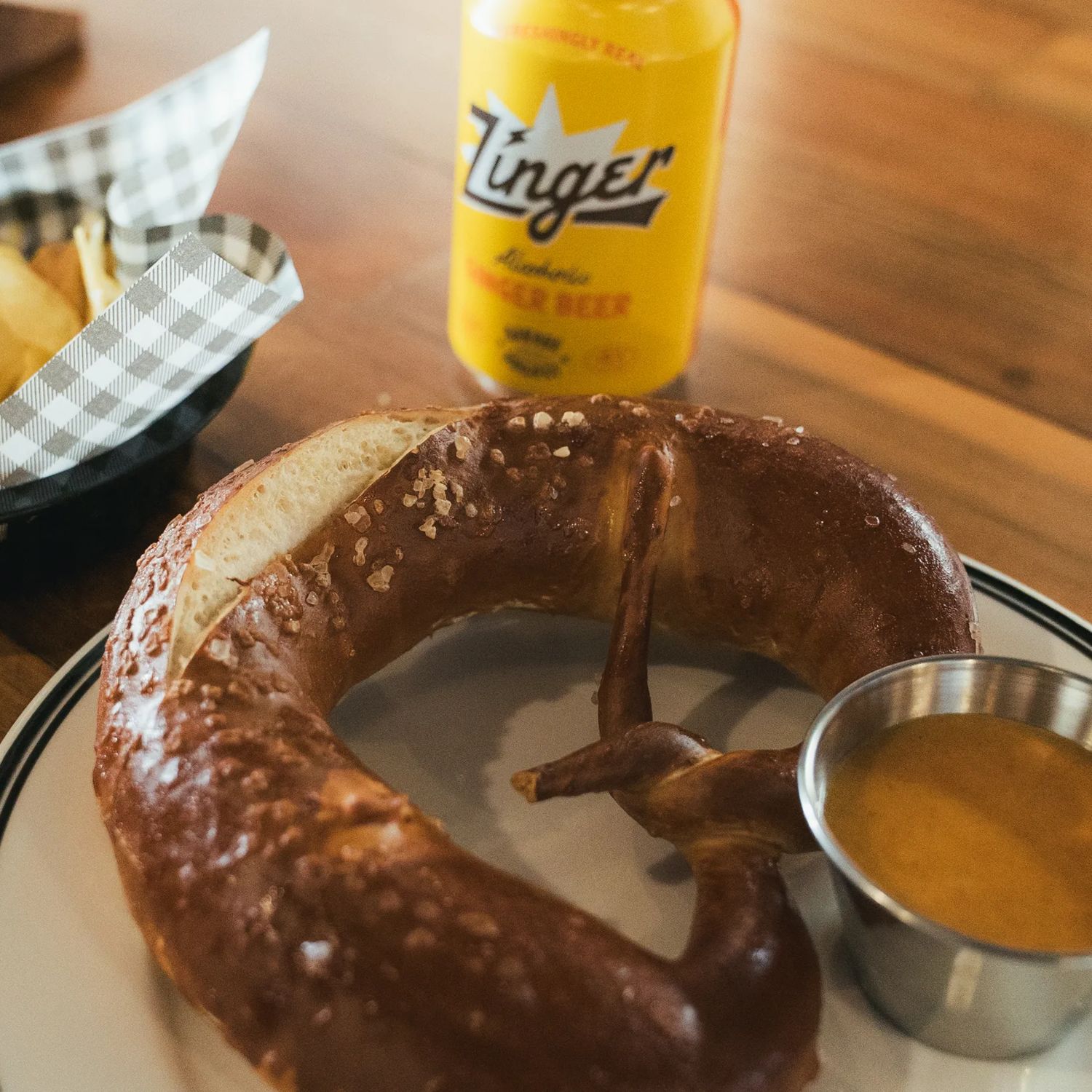 Pretzel, chips and a can of beer at Garage Project Leeds Street