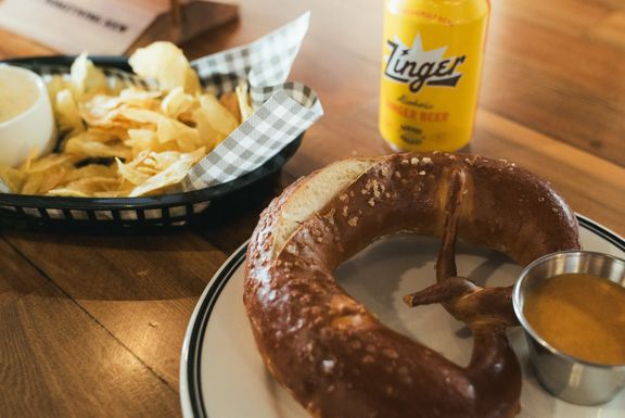 Pretzel, chips and a can of beer at Garage Project Leeds Street